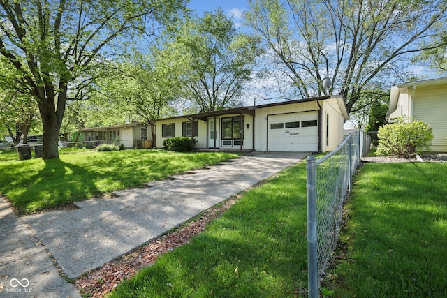 611 Hampton Ln, Anderson, IN 46017 - view of front facade with a garage and concrete driveway