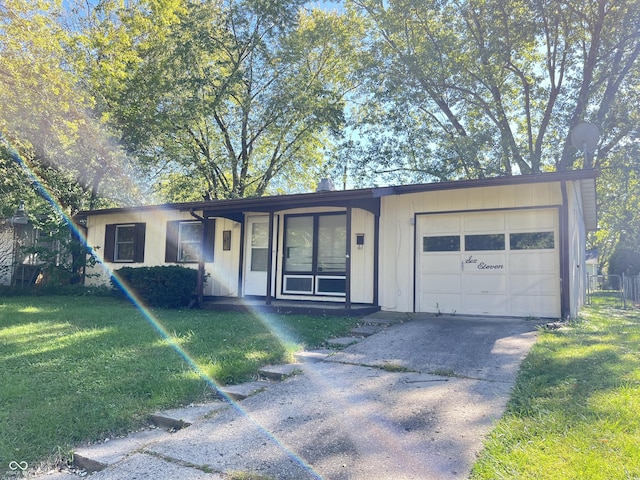 611 Hampton Ln, Anderson, IN 46017 - ranch-style home with a front yard, an attached garage, and concrete driveway