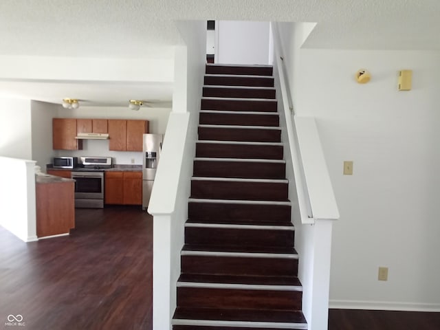 10795 Albertson Dr, Indianapolis, IN 46231 - stairway featuring wood finished floors and baseboards