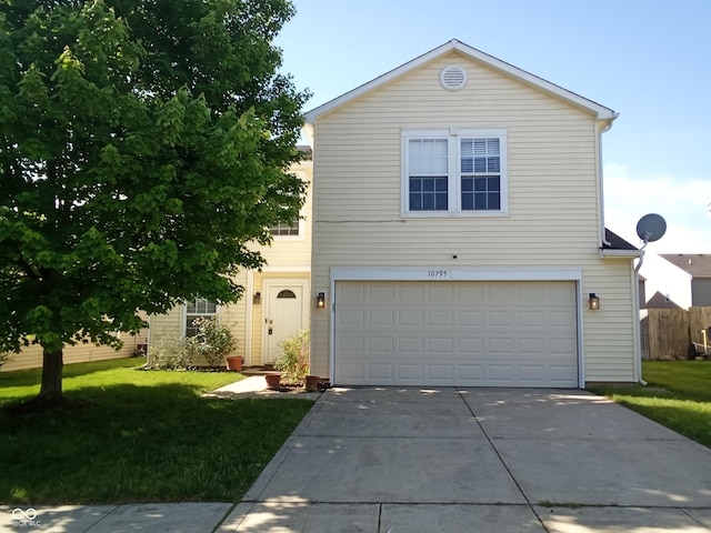 10795 Albertson Dr, Indianapolis, IN 46231 - traditional-style home featuring concrete driveway, a garage, and a front yard