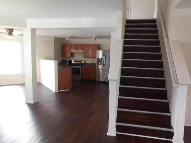 10795 Albertson Dr, Indianapolis, IN 46231 - staircase featuring wood finished floors and a ceiling fan