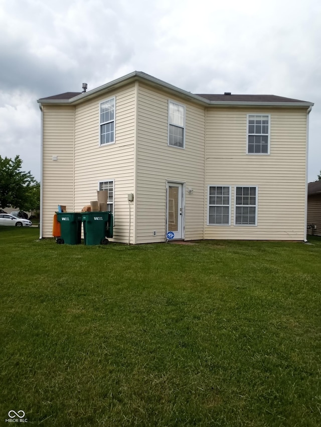 10795 Albertson Dr, Indianapolis, IN 46231 - rear view of property featuring a lawn