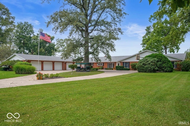 3000 E County Road 400 N, Muncie, IN 47303 - single story home featuring concrete driveway, a garage, and a front yard
