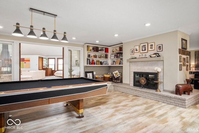 3000 E County Road 400 N, Muncie, IN 47303 - recreation room with ornamental molding, a brick fireplace, recessed lighting, billiards, and wood finished floors