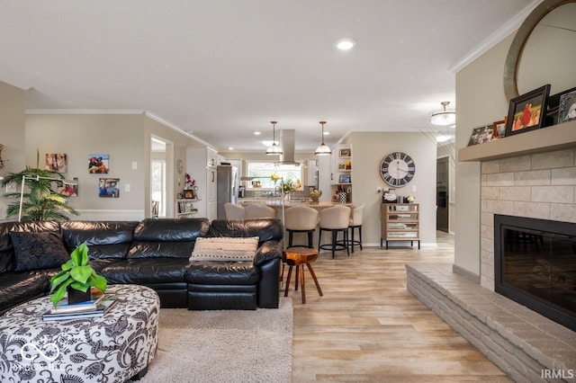 3000 E County Road 400 N, Muncie, IN 47303 - living room with crown molding, light wood-style floors, a fireplace, recessed lighting, and baseboards
