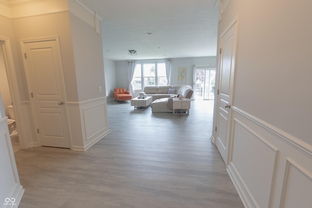 4863 Sherlock Dr, Westfield, IN 46062 - corridor featuring a decorative wall, light wood-type flooring, and a wainscoted wall