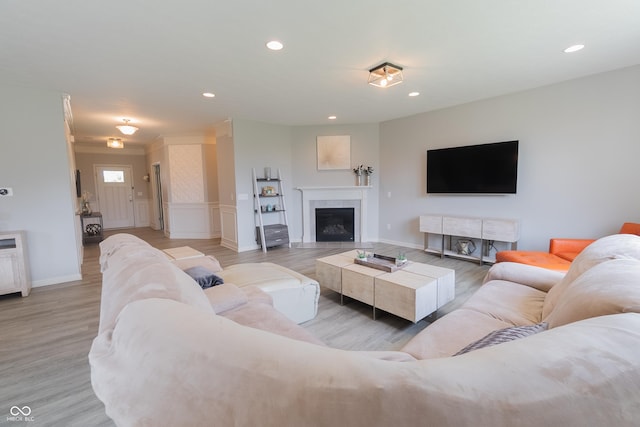 4863 Sherlock Dr, Westfield, IN 46062 - living room with wood finished floors, recessed lighting, baseboards, and a fireplace with flush hearth