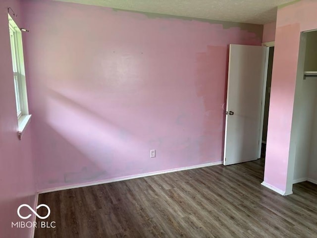 1002 Brookside Ln, Plainfield, IN 46168 - spare room featuring wood finished floors and baseboards
