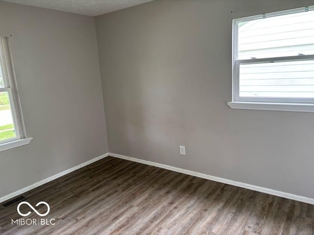 1002 Brookside Ln, Plainfield, IN 46168 - spare room featuring wood finished floors and baseboards