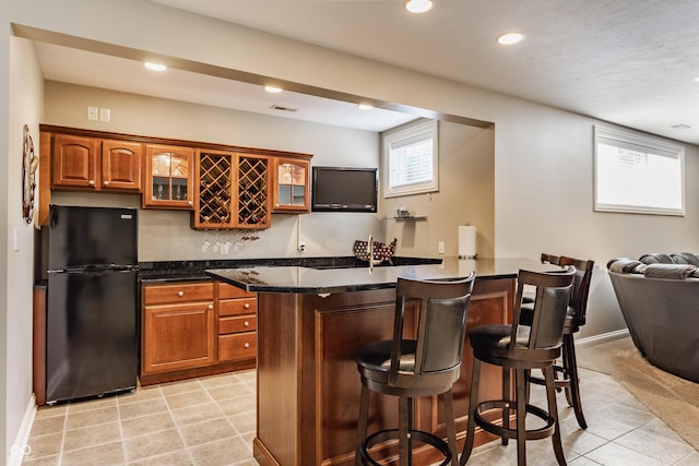10784 Giselle Way, Fishers, IN 46040 - indoor wet bar with freestanding refrigerator, recessed lighting, light tile patterned flooring, and baseboards