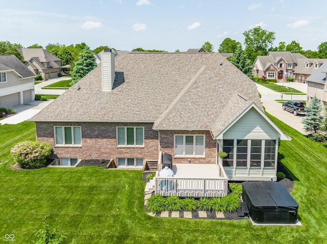 10784 Giselle Way, Fishers, IN 46040 - rear view of house with a shingled roof, a chimney, brick siding, a lawn, and a residential view