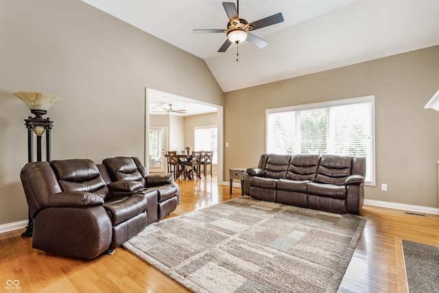 10784 Giselle Way, Fishers, IN 46040 - living room featuring ceiling fan, light wood-type flooring, baseboards, and high vaulted ceiling