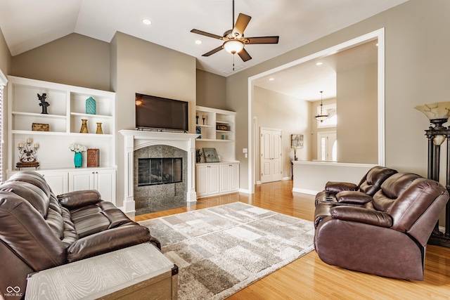 10784 Giselle Way, Fishers, IN 46040 - living area with ceiling fan, wood finished floors, a premium fireplace, recessed lighting, and lofted ceiling