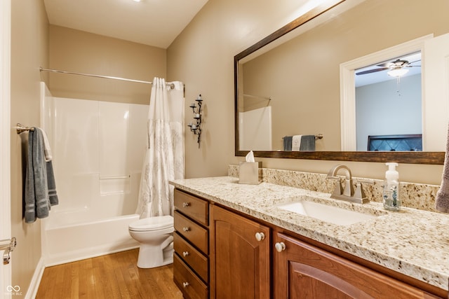 10784 Giselle Way, Fishers, IN 46040 - full bath featuring wood finished floors, vanity, toilet, shower / tub combo with curtain, and ceiling fan