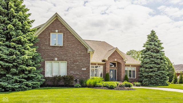 10784 Giselle Way, Fishers, IN 46040 - traditional home with brick siding, a front lawn, and a shingled roof