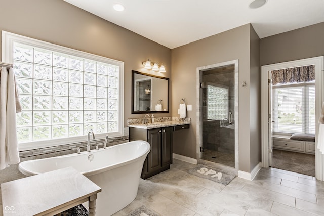 10784 Giselle Way, Fishers, IN 46040 - bathroom with a soaking tub, plenty of natural light, a stall shower, and vanity