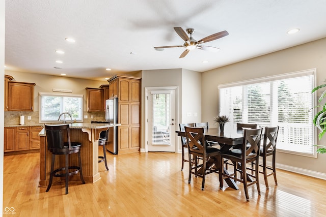 10784 Giselle Way, Fishers, IN 46040 - dining room featuring light wood-style floors, ceiling fan, baseboards, and recessed lighting