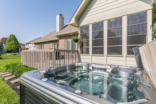 10784 Giselle Way, Fishers, IN 46040 - exterior view of brick siding, a hot tub, a chimney, and roof with shingles