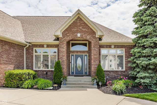 10784 Giselle Way, Fishers, IN 46040 - doorway to property featuring brick siding and a shingled roof