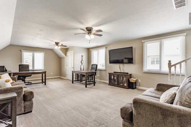 10784 Giselle Way, Fishers, IN 46040 - living area with a desk, ceiling fan, plenty of natural light, baseboards, and a textured ceiling
