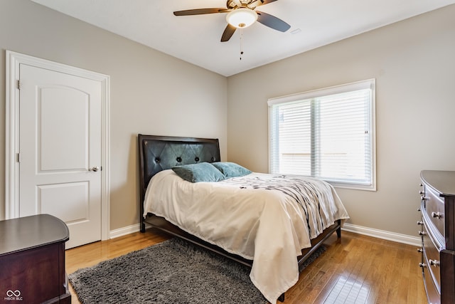 10784 Giselle Way, Fishers, IN 46040 - bedroom with wood finished floors, baseboards, and a ceiling fan