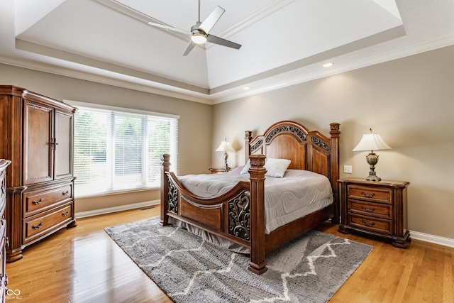 10784 Giselle Way, Fishers, IN 46040 - bedroom with a tray ceiling, light wood finished floors, recessed lighting, a ceiling fan, and baseboards