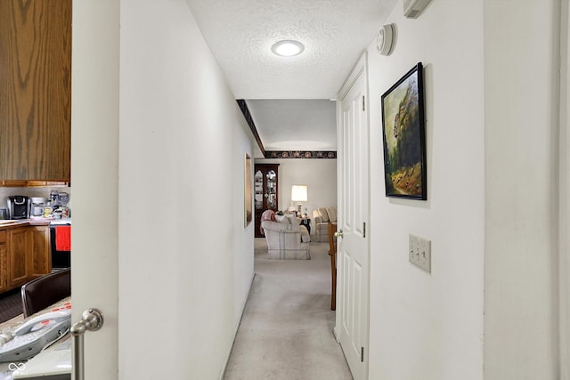 corridor with a textured ceiling
