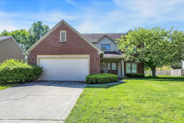 traditional home with brick siding, driveway, and a garage