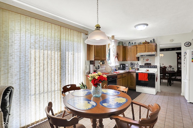dining area featuring light tile patterned floors
