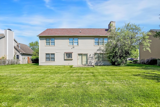 rear view of house with a chimney