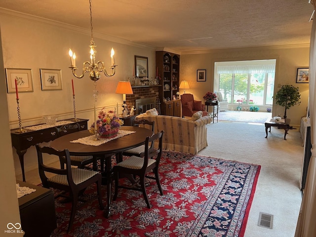 7440 Sylvan Ridge Rd, Indianapolis, IN 46240 - carpeted dining space with ornamental molding, a chandelier, and a fireplace