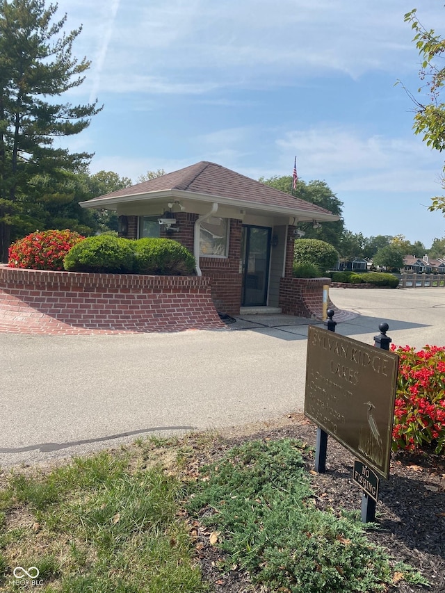 7440 Sylvan Ridge Rd, Indianapolis, IN 46240 - view of front of home featuring brick siding and roof with shingles