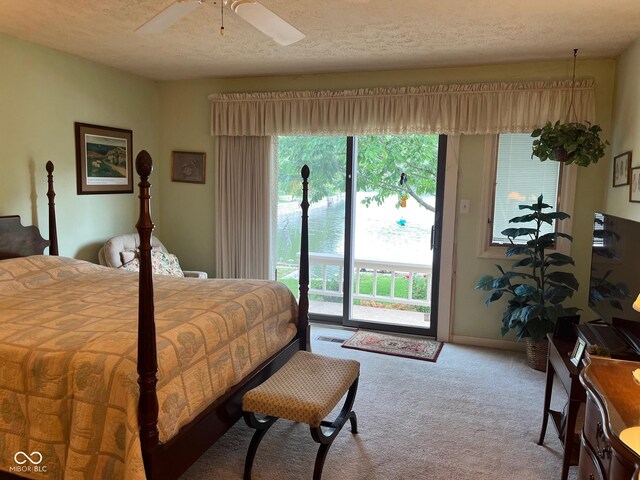 7440 Sylvan Ridge Rd, Indianapolis, IN 46240 - bedroom featuring access to outside, carpet floors, a textured ceiling, and a ceiling fan