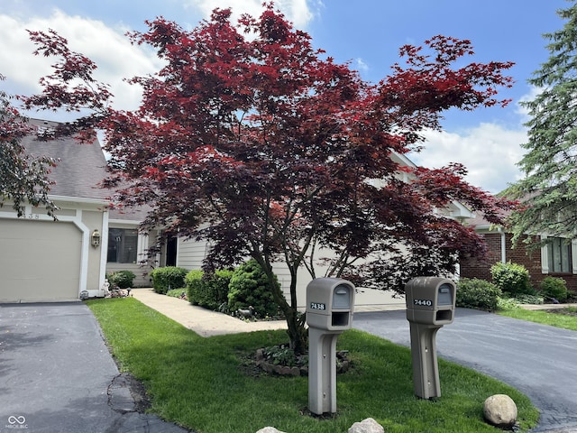 7440 Sylvan Ridge Rd, Indianapolis, IN 46240 - obstructed view of property featuring a front yard and driveway
