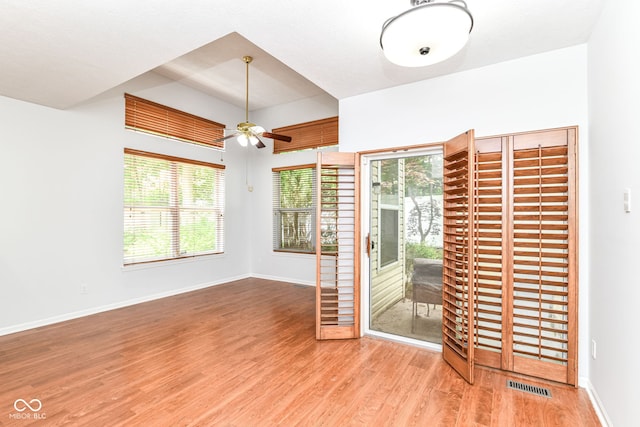 1030 Longwell Pl, Indianapolis, IN 46240 - unfurnished room with a ceiling fan, wood finished floors, plenty of natural light, and baseboards
