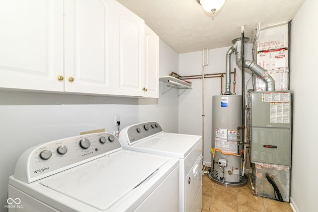 1030 Longwell Pl, Indianapolis, IN 46240 - laundry area featuring gas water heater, cabinet space, washer and dryer, baseboards, and a textured ceiling