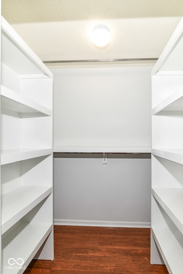 1030 Longwell Pl, Indianapolis, IN 46240 - walk in closet with dark wood-type flooring