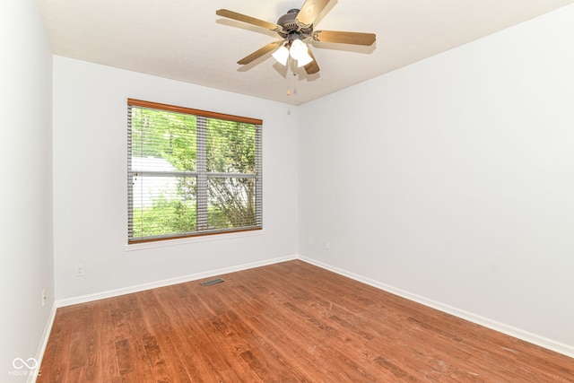 1030 Longwell Pl, Indianapolis, IN 46240 - spare room with wood finished floors, baseboards, and ceiling fan