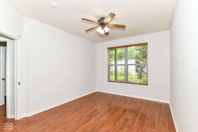 1030 Longwell Pl, Indianapolis, IN 46240 - spare room with wood finished floors, a ceiling fan, and baseboards