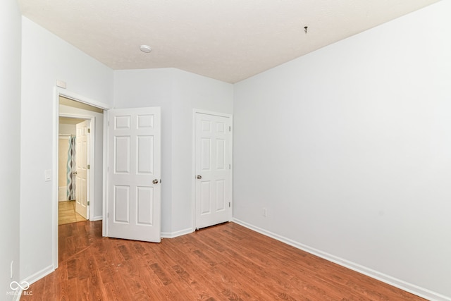 1030 Longwell Pl, Indianapolis, IN 46240 - unfurnished bedroom with wood finished floors and baseboards