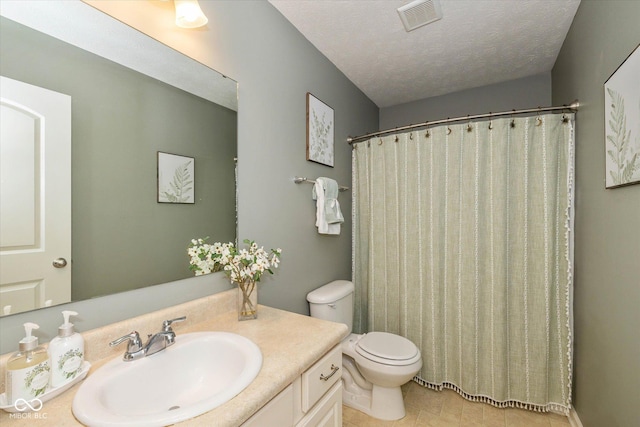4256 Zachary Ln, Westfield, IN 46062 - bathroom featuring toilet, a textured ceiling, vanity, curtained shower, and tile patterned flooring