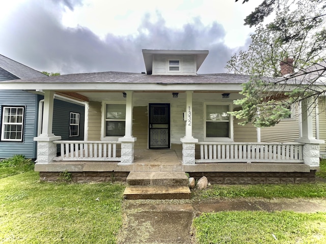 1332 W 26th St, Indianapolis, IN 46208 - view of front of property featuring a porch and a chimney