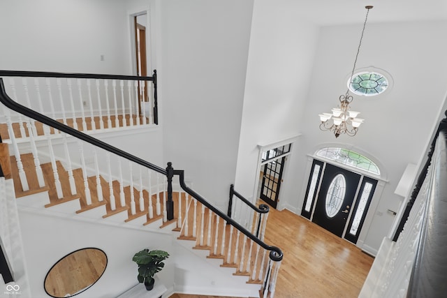 1478 W 500 S, Peru, IN 46970 - entryway with a towering ceiling, a chandelier, wood finished floors, and stairs