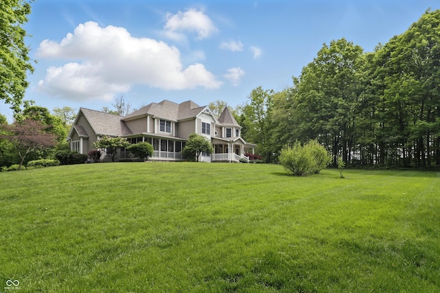 1478 W 500 S, Peru, IN 46970 - view of front of home featuring a front yard, a sunroom, and a shingled roof