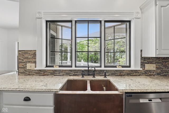 1478 W 500 S, Peru, IN 46970 - kitchen with stainless steel dishwasher, decorative backsplash, and light stone counters