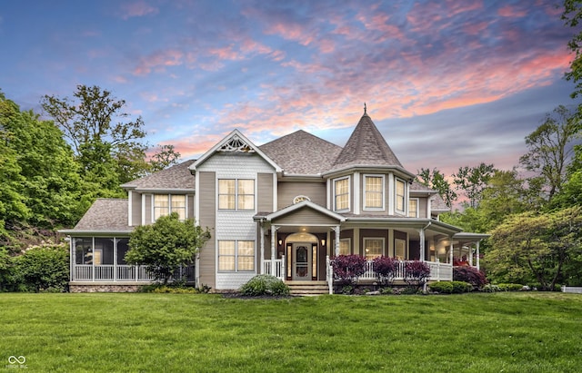 1478 W 500 S, Peru, IN 46970 - victorian-style house with a front lawn, a porch, roof with shingles, and a sunroom