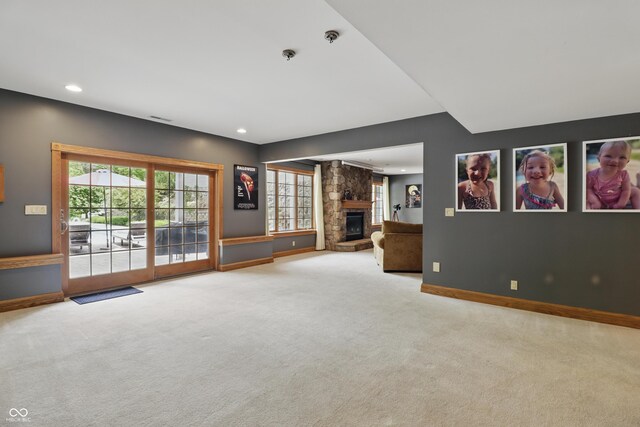 1478 W 500 S, Peru, IN 46970 - unfurnished living room with carpet floors, a fireplace, baseboards, and recessed lighting