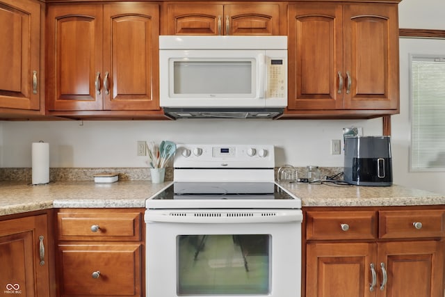 1478 W 500 S, Peru, IN 46970 - kitchen featuring white appliances and brown cabinets