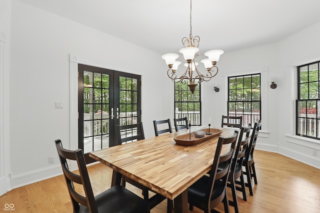 1478 W 500 S, Peru, IN 46970 - dining room with light wood-style flooring, a chandelier, french doors, and baseboards