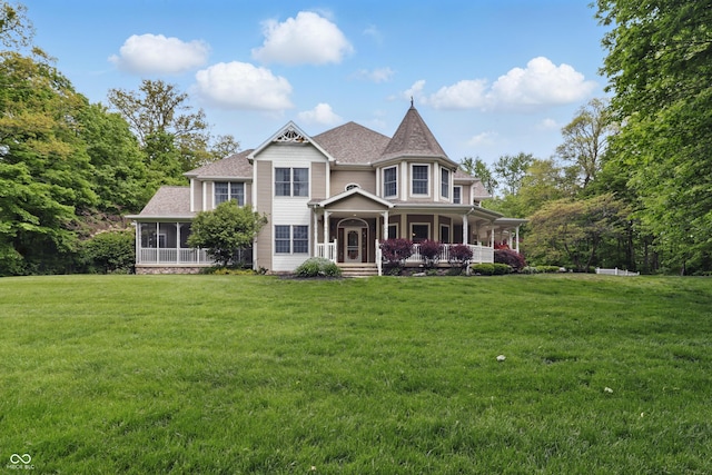 1478 W 500 S, Peru, IN 46970 - victorian home featuring a sunroom, covered porch, a front lawn, and a shingled roof